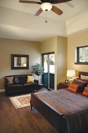 Manitou Springs apartment for rent - a bedroom with a bed and a couch and a ceiling fan