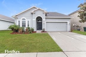 Wesley Chapel house for rent - A house with a grey roof and a black door.