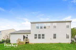Indianapolis house for rent - A house with a grassy front yard and a clear blue sky above.