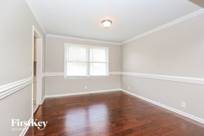 Murfreesboro house for rent - a empty room with wooden floors and a window