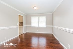 Murfreesboro house for rent - a empty dining room with wood floors and a window