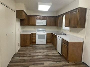 Georgetown apartment for rent - a small kitchen with a stove and a sink