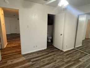 Georgetown apartment for rent - an empty living room with white walls and a wooden floor