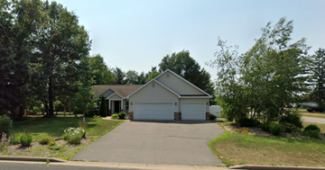 Mosinee house for rent - A house with a driveway and garage in front of it.