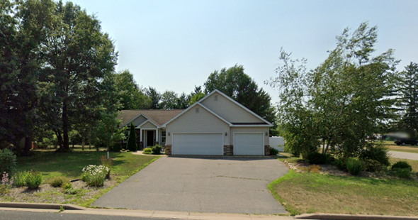 Mosinee house for rent - A house with a driveway and garage in front of it.