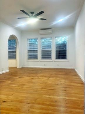 Dallas apartment for rent - an empty living room with wood floors and a ceiling fan