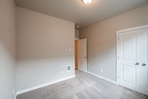 Forest Grove house for rent - a bedroom with a closet and a door to a hallway