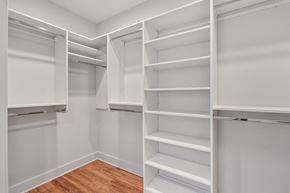 New Orleans apartment for rent - A white closet with shelves and hanging space.