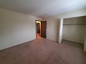 Lima apartment for rent - A room with a brown door and a white wall.