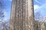 New York apartment for rent - a tall building with trees in front of it