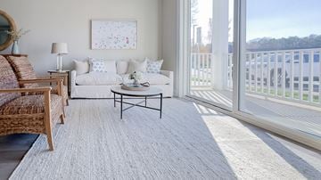 Huntersville apartment for rent - a living room with a white couch and a balcony