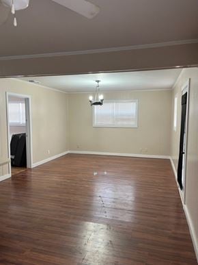 Hermleigh house for rent - an empty living room with a hard wood floor