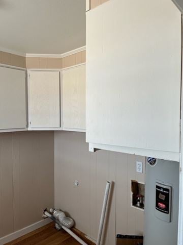 Hermleigh house for rent - a kitchen with a stove and white cabinets
