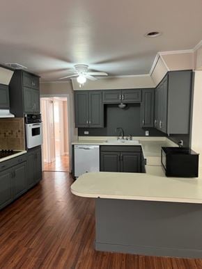 Hermleigh house for rent - a kitchen with black cabinets and a white counter top