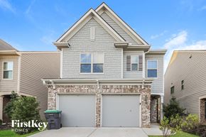Mcdonough house for rent - a house with two garage doors in front of it