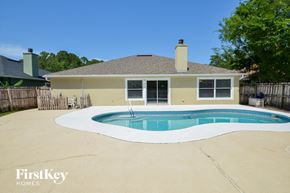 Jacksonville house for rent - A house with a pool in the backyard.