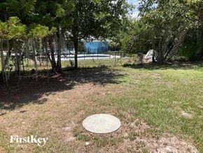 Port Charlotte house for rent - a frisbee disc on the grass in a park