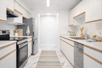 Ladysmith apartment for rent - A kitchen with white cabinets and a black oven.