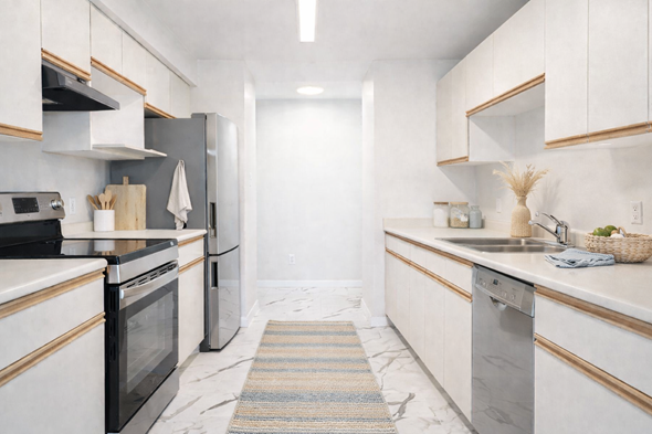 Ladysmith apartment for rent - A kitchen with white cabinets and a black oven.