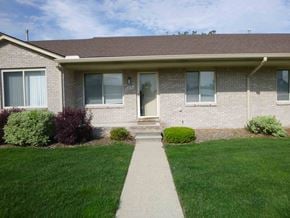 Clinton Township house for rent - A house with a brown roof and a white door.