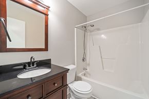 Jacksonville house for rent - A bathroom with a sink, toilet, and bathtub.