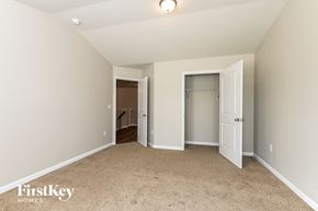Mcdonough house for rent - a bedroom with a closet and a door to a bathroom