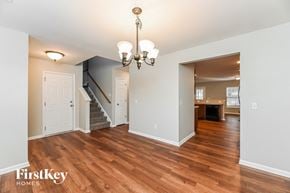 Summerville house for rent - a renovated living room and dining room with wood flooring
