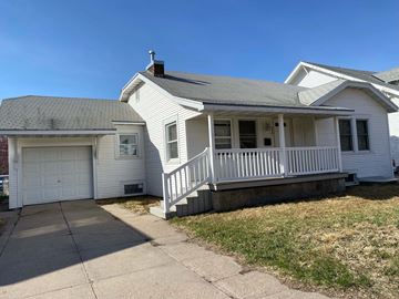 Kearney apartment for rent - a white house with a porch and a white garage door