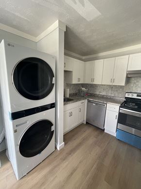 Riverdale apartment for rent - a kitchen with a washer and a dryer in it