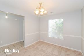 Memphis house for rent - a dining room with a window and a chandelier