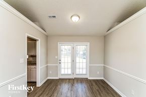 High Point house for rent - A room with a door and a window.