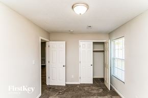 High Point house for rent - A room with two white doors and a window with blinds.