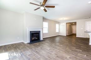 Dallas house for rent - the living room has a fireplace and hardwood floors