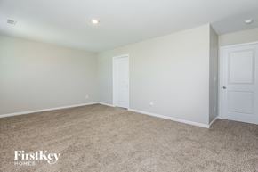 Dallas house for rent - a bedroom with white walls and carpet and white doors