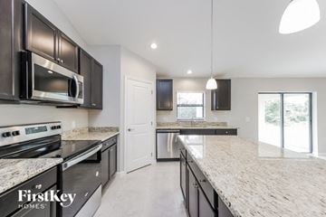 Lehigh Acres house for rent - a modern kitchen with granite counter tops and stainless steel appliances