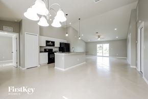 Lehigh Acres house for rent - A spacious kitchen and living room with a modern design.