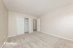 Winston-Salem house for rent - a bedroom with a carpeted floor and white doors