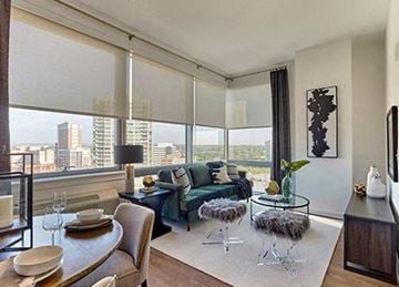 New Brunswick apartment for rent - A modern living room with a dining table set for two.
