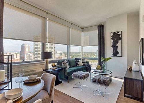 New Brunswick apartment for rent - A modern living room with a dining table set for two.