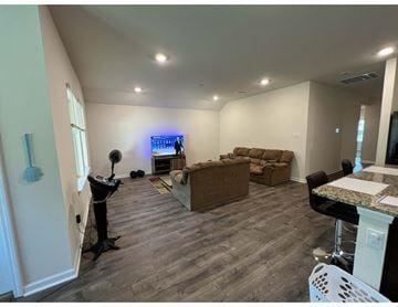 Youngsville house for rent - a living room with a couch and a tv