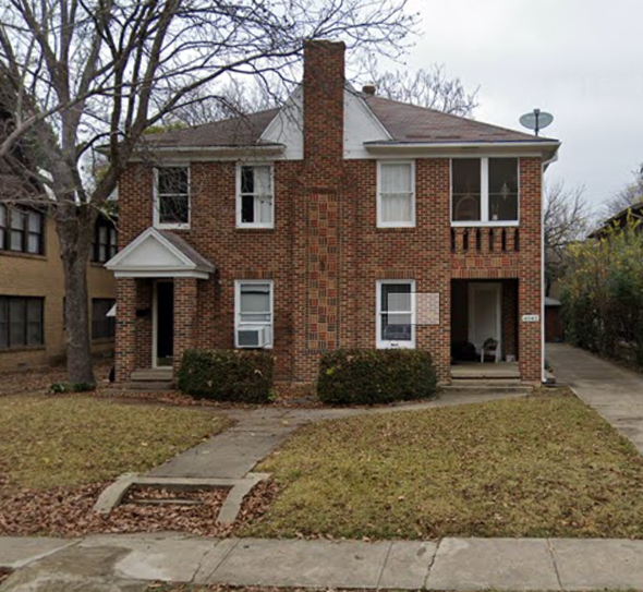 Dallas apartment for rent - a brick house with a sidewalk in front of it