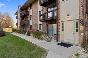 Naperville apartment for rent - Apartment building with balconies and doors on the ground floor.