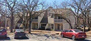 Denton apartment for rent - a large house with cars parked in front of it
