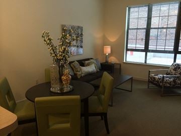 Baltimore apartment for rent - a living room with a table and chairs and a couch
