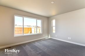 Colorado Springs house for rent - an empty living room with a large window