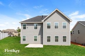 Colfax house for rent - A two-story house with a grey exterior and a white roof.