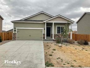 Colorado Springs house for rent - a house with a driveway and a garage door
