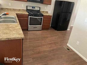 Colorado Springs house for rent - a kitchen with a stove and a refrigerator