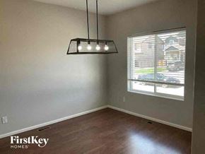 Colorado Springs house for rent - a empty room with a window and a light fixture