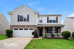 Gastonia house for rent - A house with a garage and a front porch is for sale.